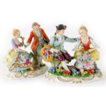 A pair of Sitzendorf figure groups of lovers with flowers, 12cm high.