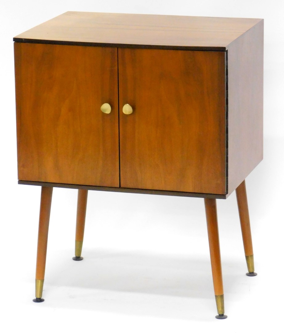 A 1960's walnut record cabinet, with turned tapering legs, 50cm wide.