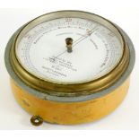 A Negretti & Zambra Fishermen's Aneroid barometer, the dial printed, issued by the Royal National Li