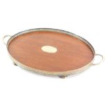 A silver plated and mahogany galleried tray, with vacant oval cartouche, 61cm long.