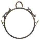 A blacksmith made wrought iron wall display bracket, decorated with horseshoes and spanners, with tw
