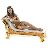 A Nadal porcelain figure of a reclining nude Cleopatra, 41cm long.