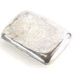 A late Victorian silver cigarette case, of rounded form, engraved with flowers, with shield shaped c