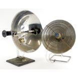 A vintage heat lamp, with chrome plated bowl and metal base, and another similar. (2)
