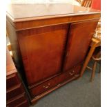 A mahogany television cabinet, with two doors and one drawer, 105cm high, 88cm wide, 57cm deep.