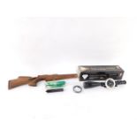 A Nikko Sterling Diamond gun sight, 47cm wide, a Falcon silencer and a plain stock. (3, 2 boxed)