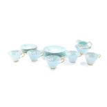 A Paragon porcelain early 20thC part tea service, decorated with white primroses against a turquoise