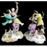 A pair of 19thC Continental porcelain figure groups, of young lovers, in polychrome decoration, 23cm