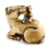 A Japanese late Taisho / early Showa period stained ivory netsuke, carved as two horses, signed, 37