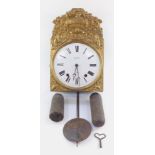 Jeannin A' Buxy. A 19thC gilt brass comtoise wall clock, with elaborate repousse decoration, with ur