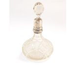 An Edward VII cut glass scent bottle and stopper, with silver collar, Birmingham 1908, 17cm high.