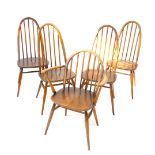 A set of five (four plus one) Ercol hoop back dining chairs, each with spindle backs, plain seats an