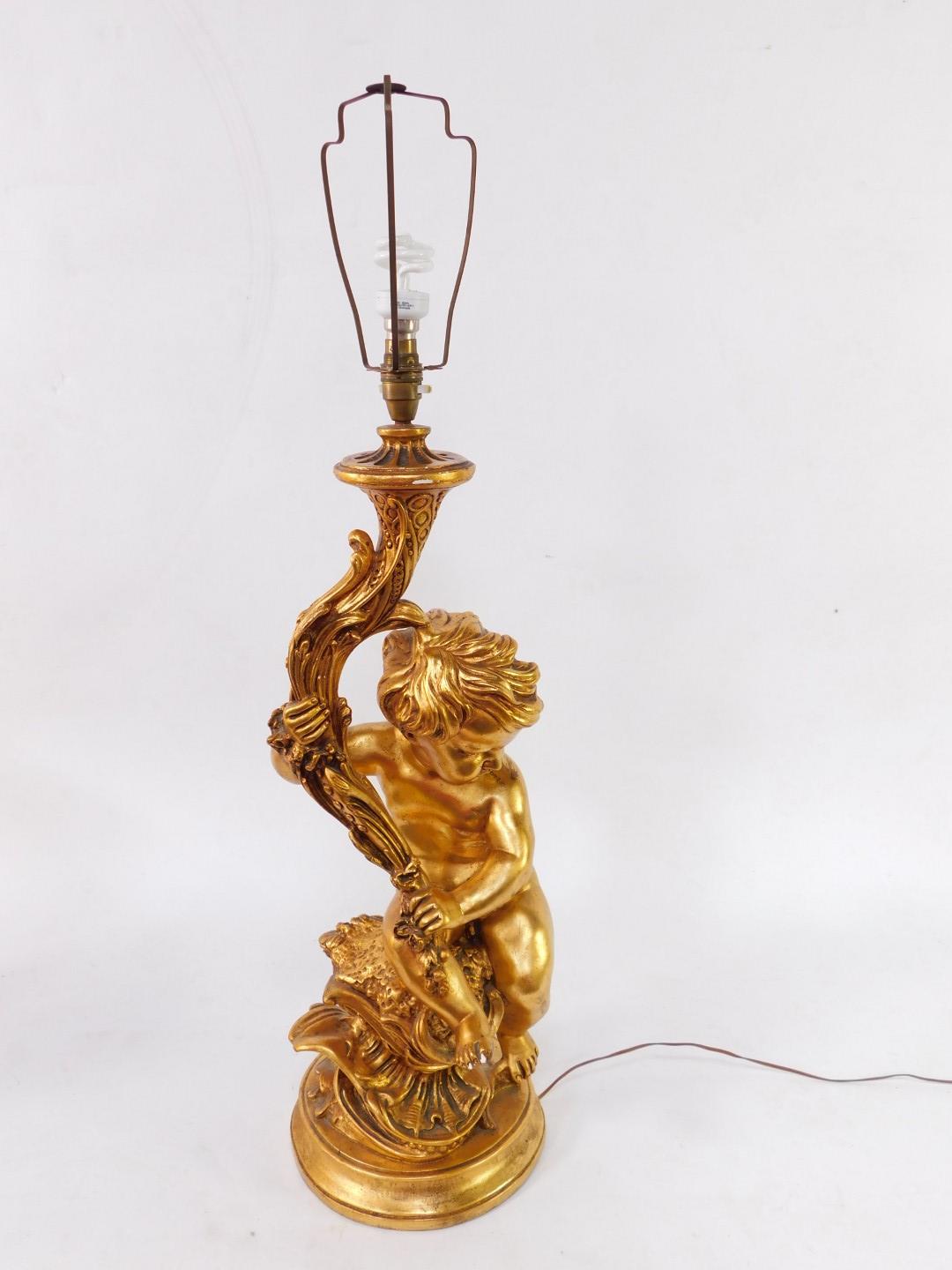 A 20thC plaster finish rococo table lamp, formed as a figure of a child, entwined stem, on a circula - Image 2 of 3