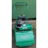 A Qualcast Classic petrol cylinder mower.