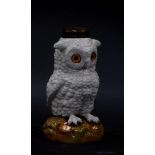 A German late 19thC porcelain novelty lamp base, modelled as an owl, in standing pose, with inset gl