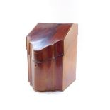 A George III serpentine mahogany knife box, with cross banded lid, plain interior, and moulded base,
