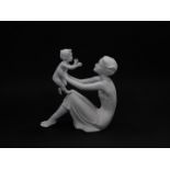 A Kaiser white matt bisque porcelain figure, modelled as Mother and Child, no 398., printed and impr