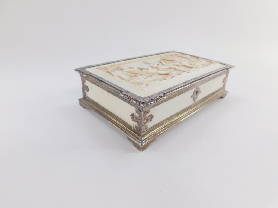 A Victorian silver and ivory box, of rectangular form, the lid heavily carved with three cherubs pla - Image 3 of 7