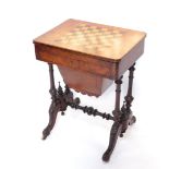 A Victorian walnut writing, games and work table, the hinged lid with a chequer board top revealing