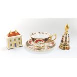 A Royal Crown Derby imari candle snuffer, pattern no 1128., porcelain model of The China Shop, and a