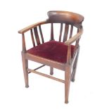 An early 20thC mahogany open tub chair, with cresting rail above vertical sections with a drop-in se