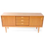A Schreiber retro teak sideboard, of rectangular form with three cutlery drawers flanked by sliding