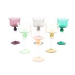 A harlequin set of mid century coloured wine glasses, raised on spiral twist stems. (6)