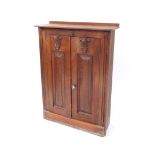 A 19thC ecclesiastical style pine vestment type cupboard, with carved semi circle acanthus leaf moul