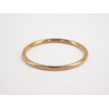 A 9ct gold bangle, interior diameter 6.5cm, 7.2g.