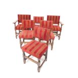 A set of six oak dining chairs, each with overstuffed backs and seats, in red lined material, on tur