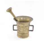 An 18thC brass pestle and mortar, of tapering bell shaped form, with angular C shaped handles, 9cm h
