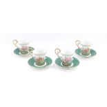 Four Kaiser porcelain demi tasse coffee cups and saucers, decorated with flowers, commemorating the