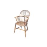 A late 19thC ash and elm low back Windsor chair, with pierced fretwork style splat, C shaped arms, t