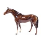 A Beswick figure of a brown gloss horse, printed mark, 35.5cm wide.