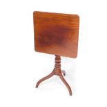A 19thC mahogany tilt top occasional table, the oblong top raised on a baluster stem terminating in