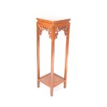 A Chinese hardwood urn stand, of square section, with an under tier, raised on square legs, 102cm hi