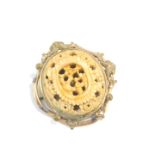A Victorian gilt metal brooch, set with a Chinese ivory, carved with figures and flowers, 5.5cm wide