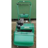 A Qualcast Classic petrol cylinder mower.