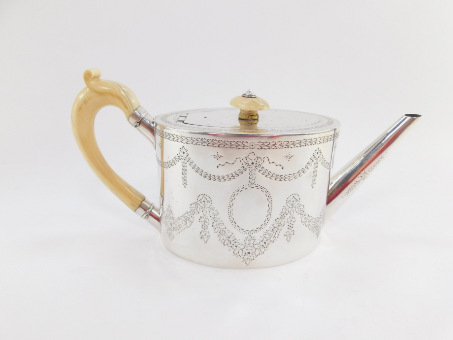 A Victorian silver teapot, the oval body with ivory handle and knop, plain spout, chased with garlan - Image 3 of 7