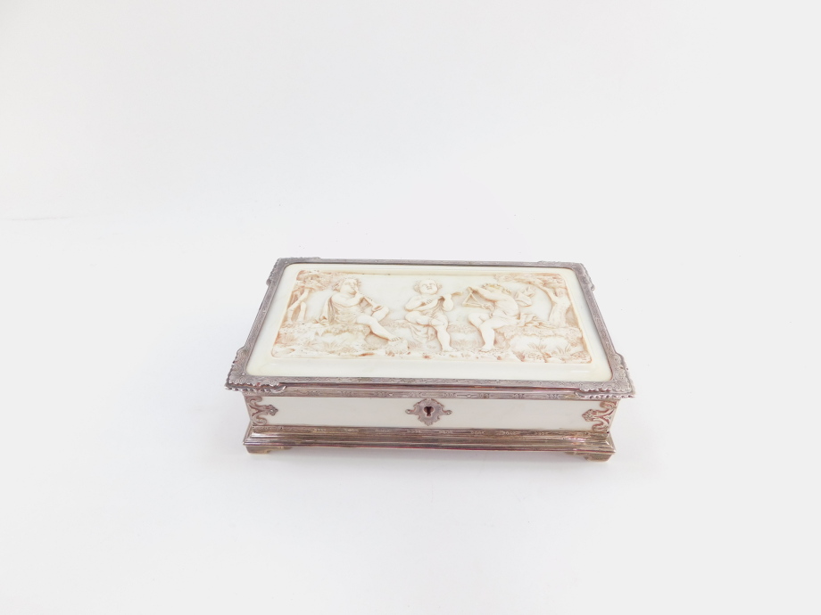 A Victorian silver and ivory box, of rectangular form, the lid heavily carved with three cherubs pla - Image 2 of 7