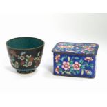 A late 19thC Chinese cloisonne box and cover, of oblong form, set with flowers against a blue ground