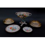 A German porcelain pedestal sweetmeat basket, encrusted with flowers and fruit, Dresden porcelain as