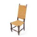 An early 20thC oak and wool work open chair, with shaped back and seat, on compressed bobbin turned