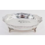 A George V silver dish, the dodecahedral body with a pierced rim on quadruple scroll feet, Birmingha