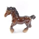 A Beswick pottery cantering Shire Horse, in brown, black and white colourway, printed marks beneath,