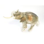 A Royal Dux porcelain figure of an elephant, trunk raised, no. 378/2 79, impressed and printed marks