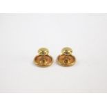 A pair of 18ct gold shirt studs, 1.6g.