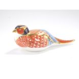 A Royal Crown Derby imari porcelain paperweight modelled as a pheasant.