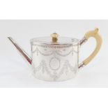 A Victorian silver teapot, the oval body with ivory handle and knop, plain spout, chased with garlan
