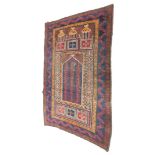 A 20thC prayer rug, probably Iranian, of rectangular form, with floral and domed Mihrab, and outer f